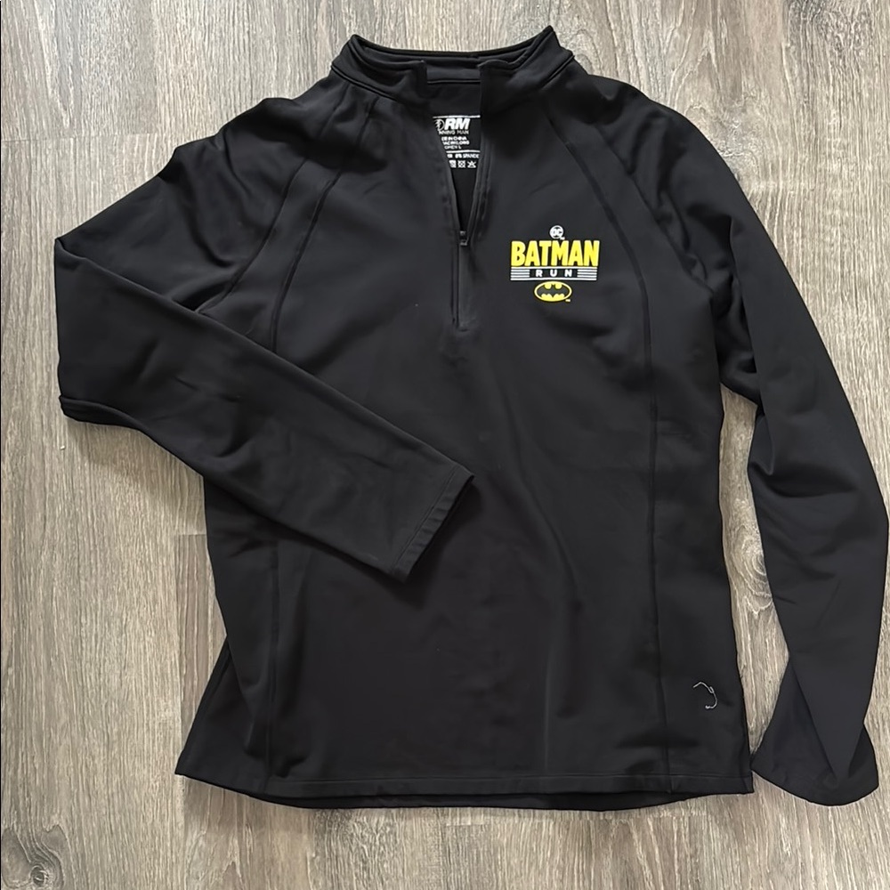 Women’s large 1/4 zip running shirt with Batman logo.